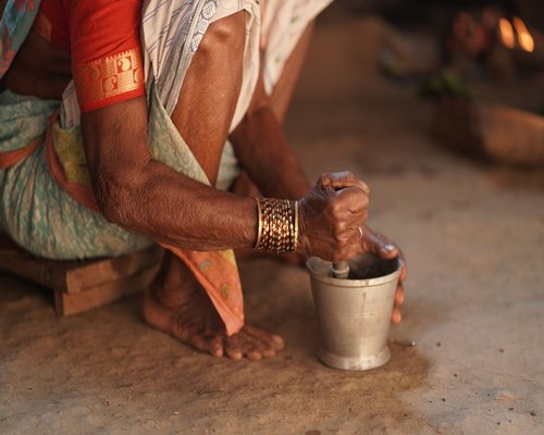 Indian woman stretching at home in the morning light